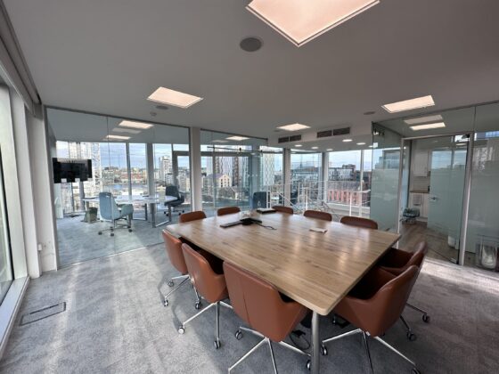 Glass-walled boardroom at Venturewave's Dublin headquarters, overlooking Grand Canal Dock.