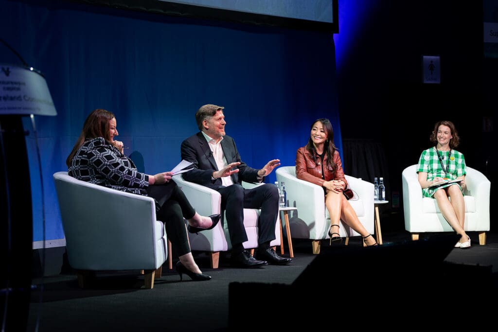 Panel discussion at Impact Ireland 2025 on energy, growth and security, with four speakers on stage in conversation