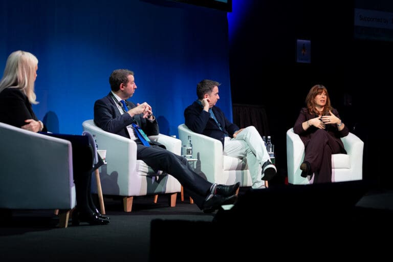 Panel discussion on AI and new technologies at the Global Advisory Council 2025, with four speakers on stage in conversation