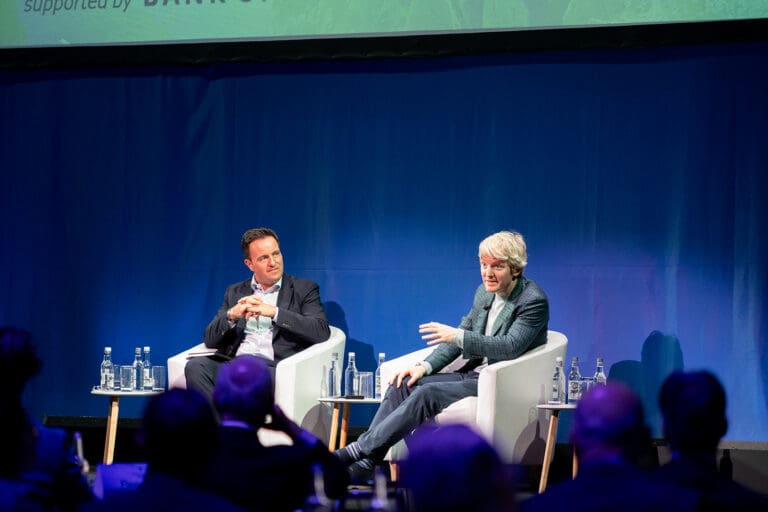Patrick Collison and Alan Foy speaking on stage during Impact Ireland 2025 about innovation, AI and Ireland’s future